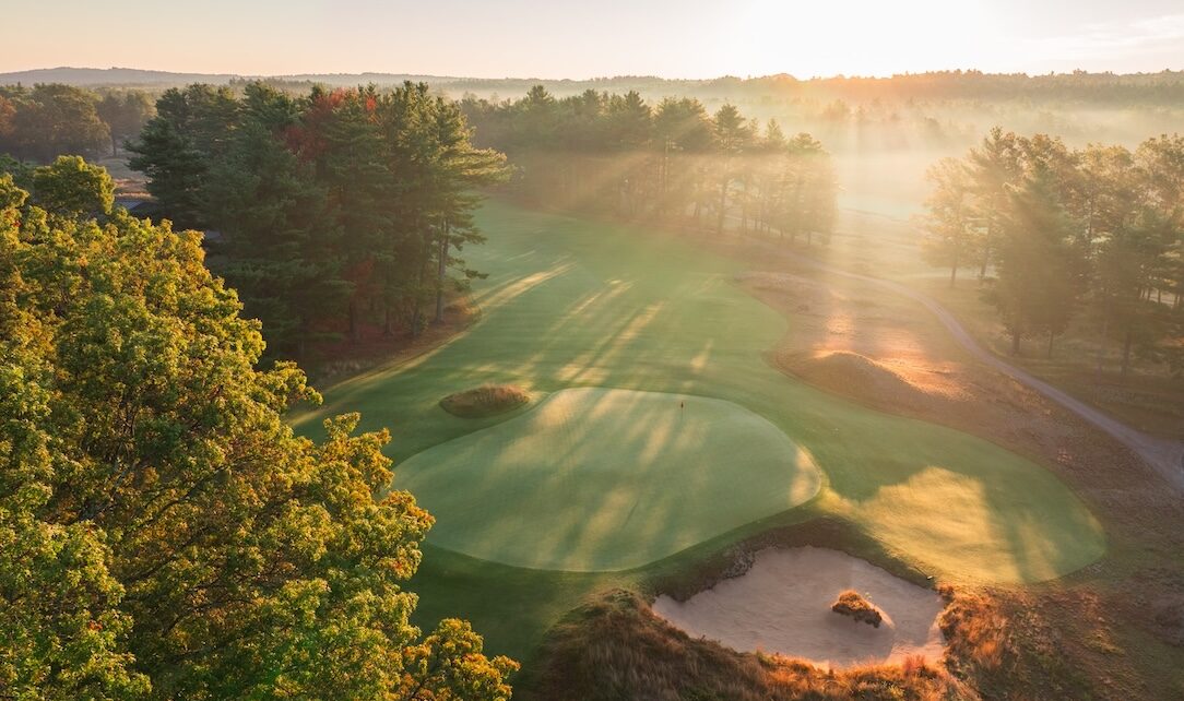 low golden sunlight shining across a beautiful new golf hole