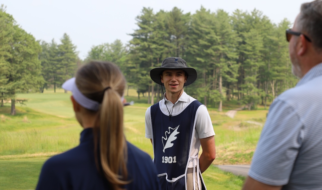 caddie explaining the first hole of the international